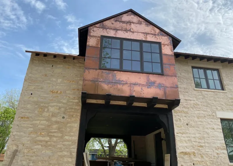 Copper metal panel facade on a stone building for Metal Roof Coating in Summit View