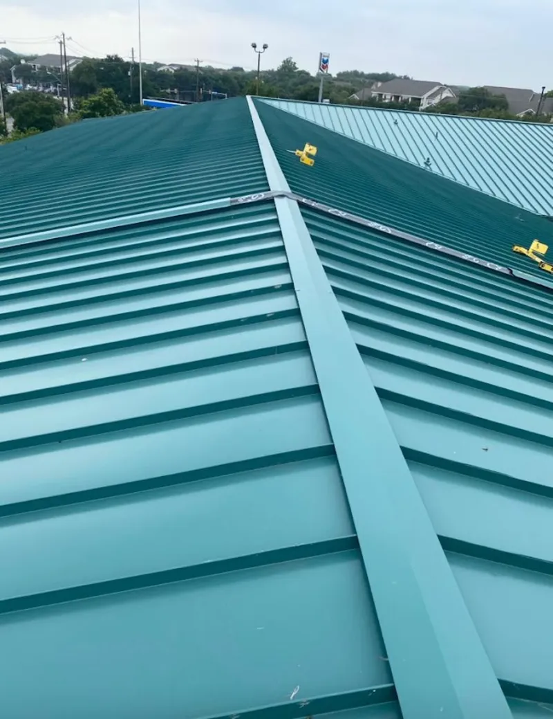 Green commercial metal roof ridge and valley for Metal Roof Repair in Summit View